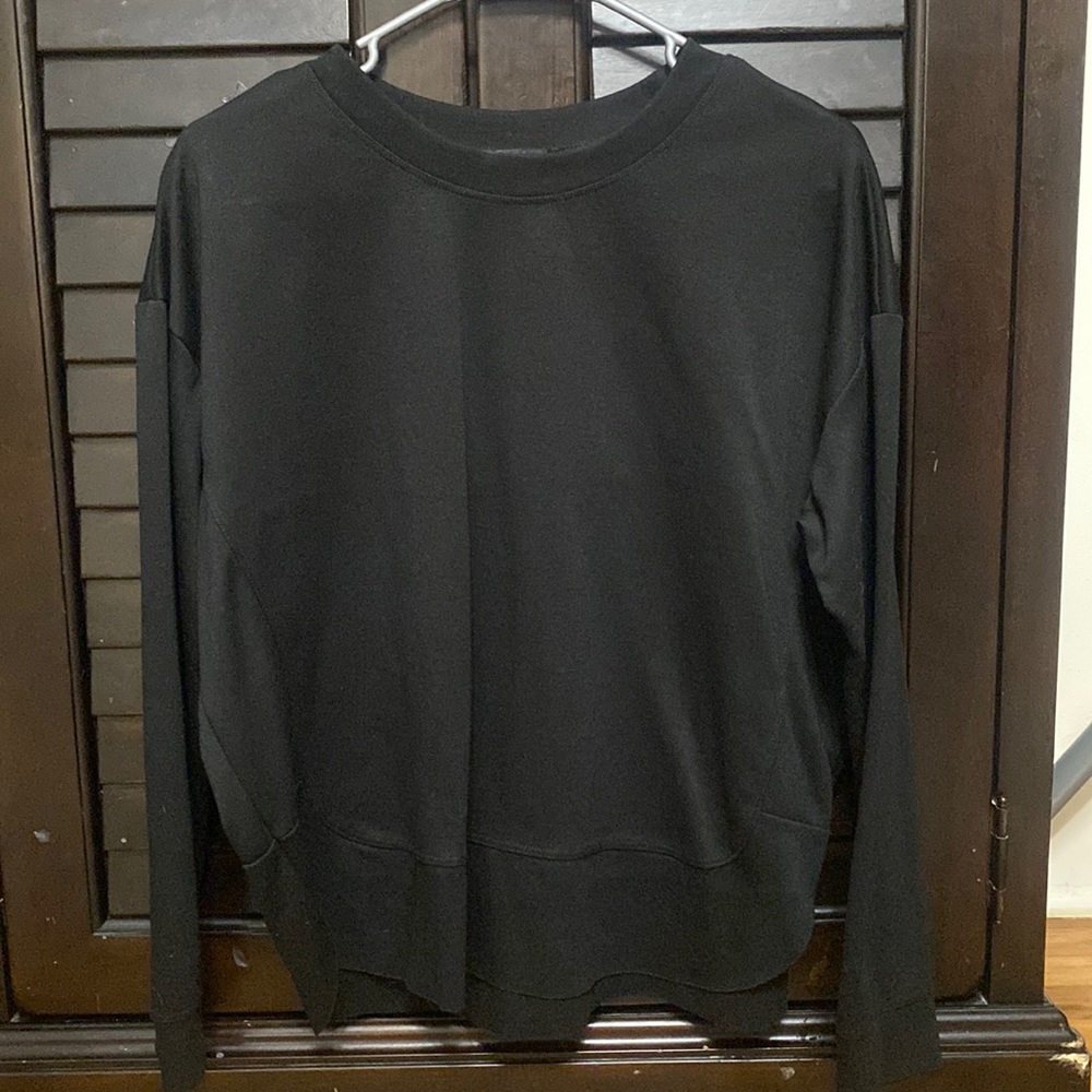 Black thicker plain cute shirt. only tried on. too small for me. great condition